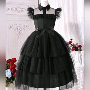 Wednesday black dress and It(hand)